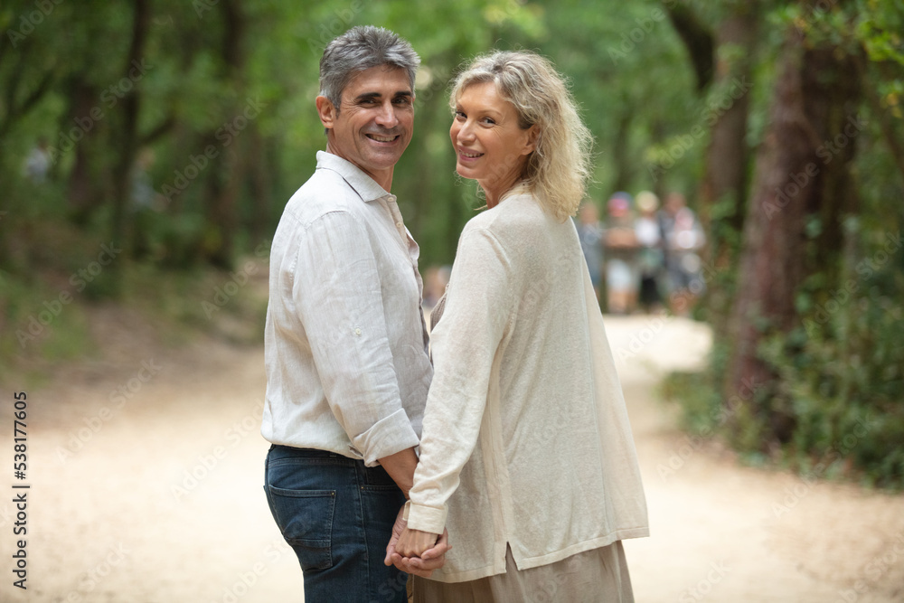 cute middle aged couple embracing outdoors cute middle aged couple embracing outdoors