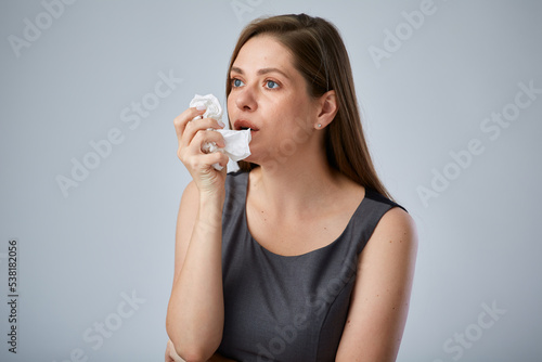 Sick coughing business woman using napkin. isolated advertising portrait.