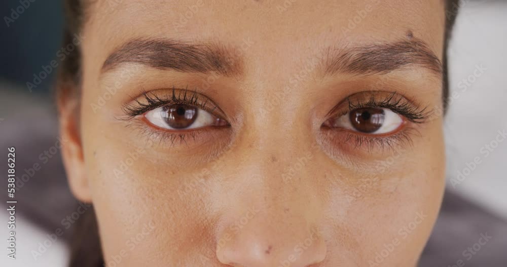 Video close up portrait of eyes of happy biracial woman smiling to camera at home Video close up portrait of eyes of happy biracial woman smiling to camera at home