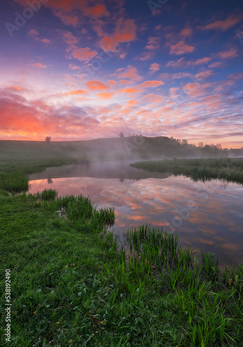 Beautiful spring sunrise over river bank. nature of Ukraine