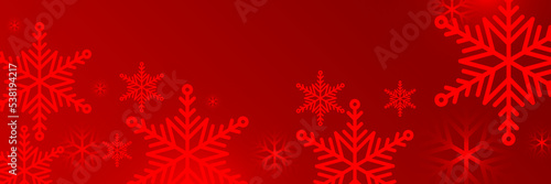 Red and white christmas snowflake banner background with text space