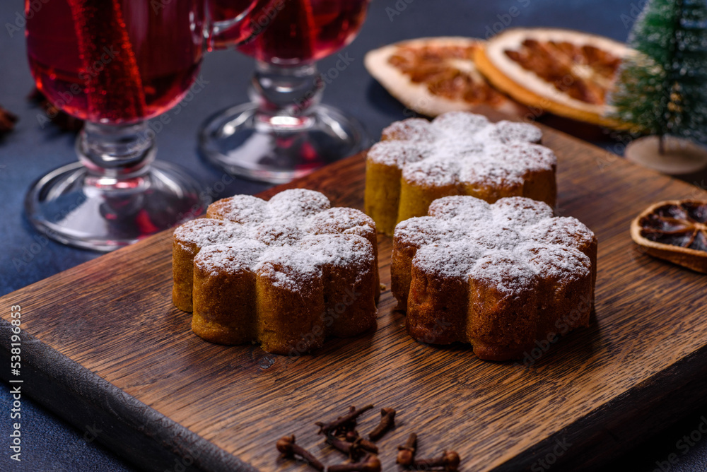 Hot mulled wine with a slice of orange, with cinnamon, cloves and other spices