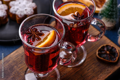 Hot mulled wine with a slice of orange, with cinnamon, cloves and other spices