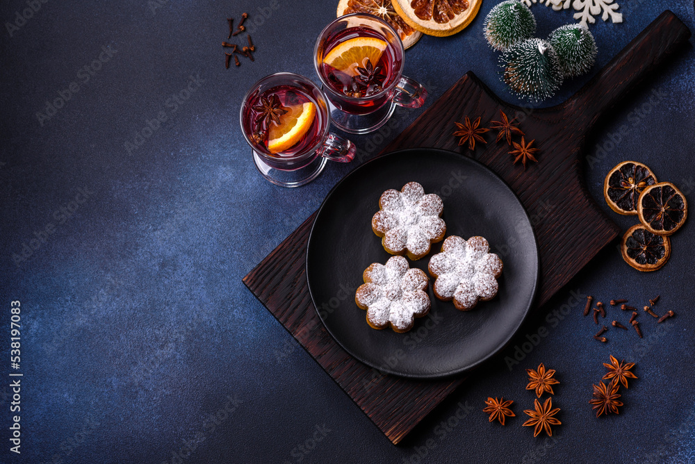 Hot mulled wine with a slice of orange, with cinnamon, cloves and other spices