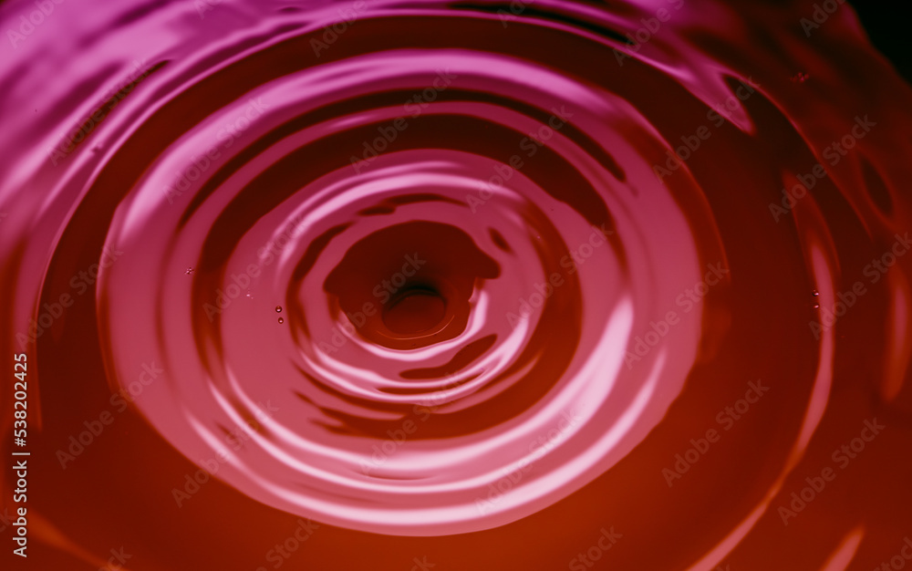 abstract background with circles on pink liquid abstract background with circles on pink liquid