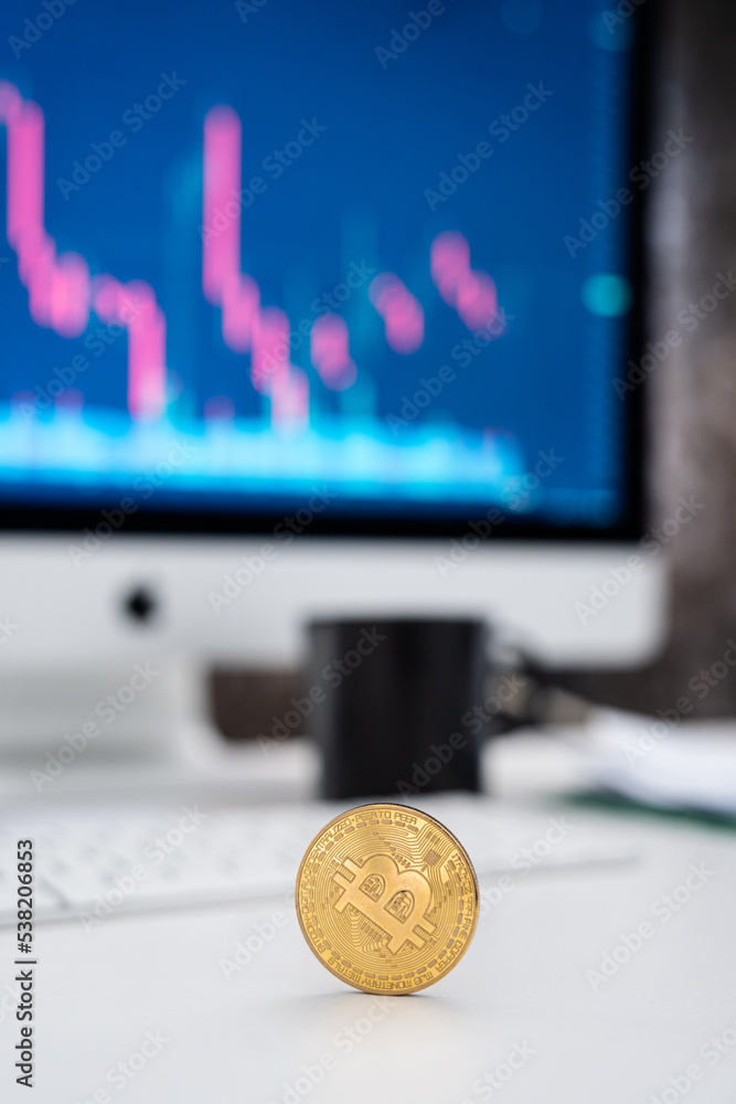 bitcoin - the fall of electronic currency - gold coin - background chart