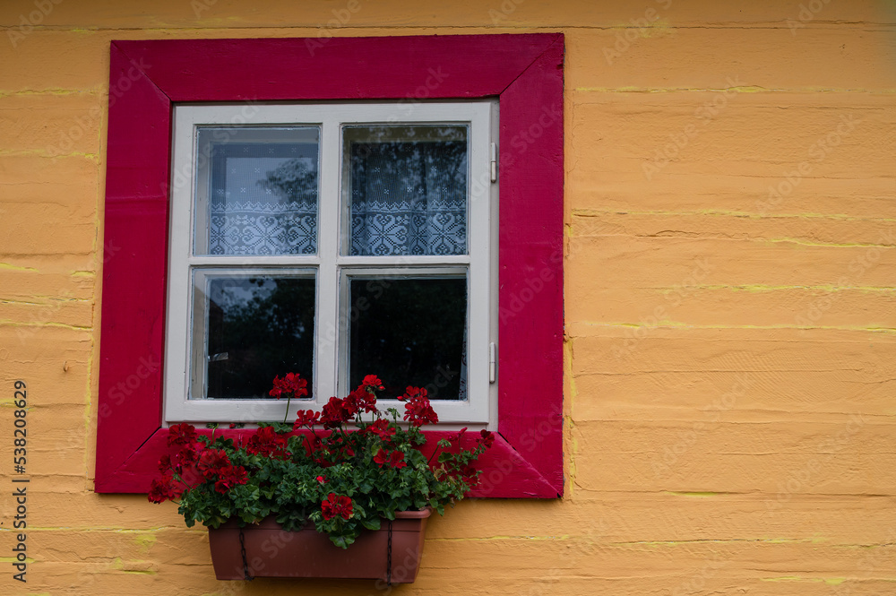 wooden classic window in the old colorful wall