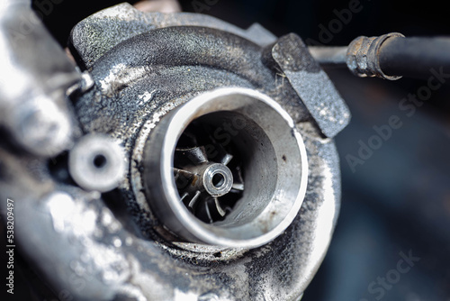Fotografie car engine turbine in oil soot.