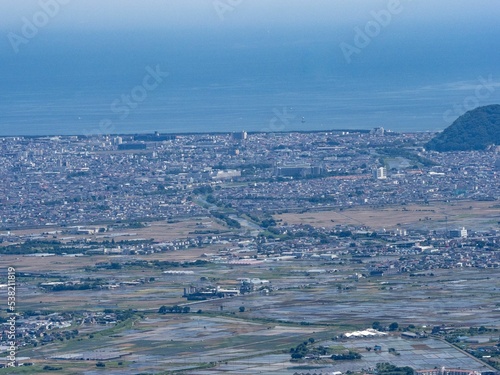 Aerial shot of Chigasaki, Hiratsuka, and Sagami Bay from the side of Mt. Oyama in Isehara, Japan photo