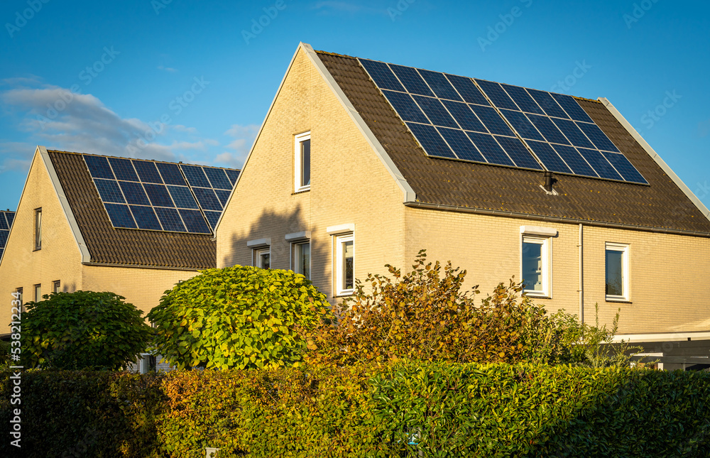 Solar panels on roofs on modern houses, largest photovoltaic neighbourhood of The Netherlands in the city of Heerhugowaard Solar panels on roofs on modern houses, largest photovoltaic neighbourhood of The Netherlands in the city of Heerhugowaard