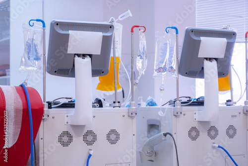 Plasma donation devices with display stands at medical canter. Contribution. Healthcare. Professional. Medicine. Laboratory. Transfer. Needle. Volunteer. Test. Nursery. Lab. Therapy. Aid. Help photo