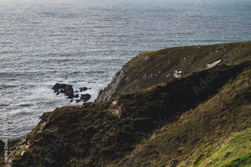 Cliffs and mountain on irish coast, county Mayo, Irish nature landscape.