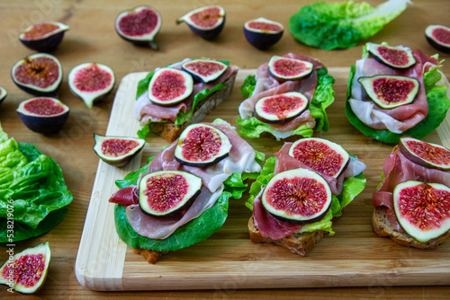 Sandwiches with lettuce  ripening ham and figs 