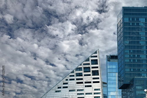 modern office building/ cloudy sky