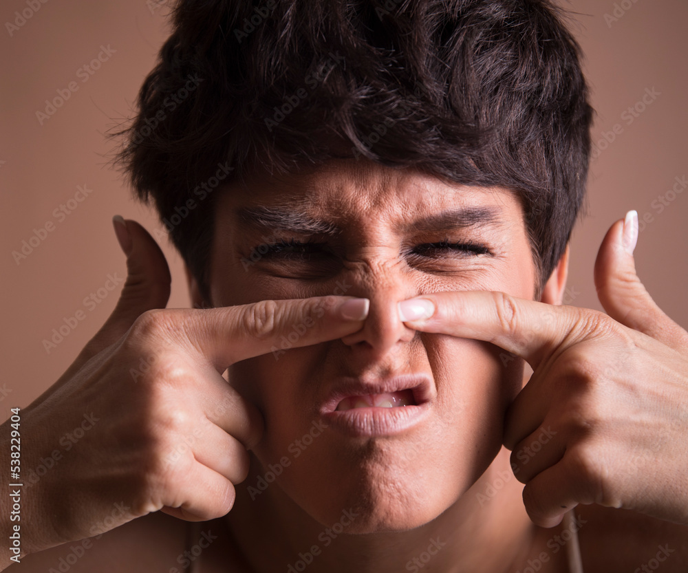 portrait of a man with a headache. Acne. Acne woman. Pain. Fun. Emotion face. portrait of a man with a headache. Acne. Acne woman. Pain. Fun. Emotion face.