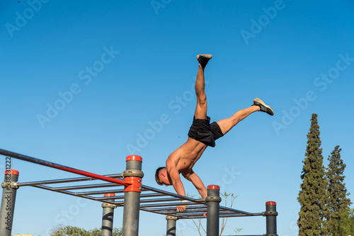sportswoman doing outdoor gymnastics, athlete, calisthenics
