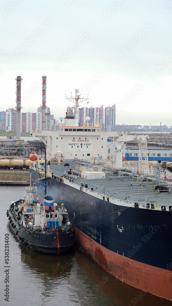 Port of Tallinn, Estonia - 10 04 2022: Side view of the large oil tanker in the European port