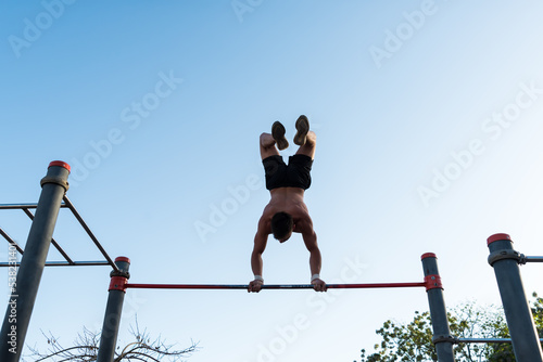 sportswoman doing outdoor gymnastics, athlete, calisthenics