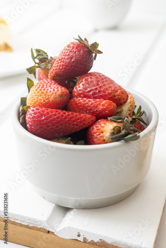 bowl with fresh red berries, healthy food and ingredient, delicious in studio, details of the texture photo