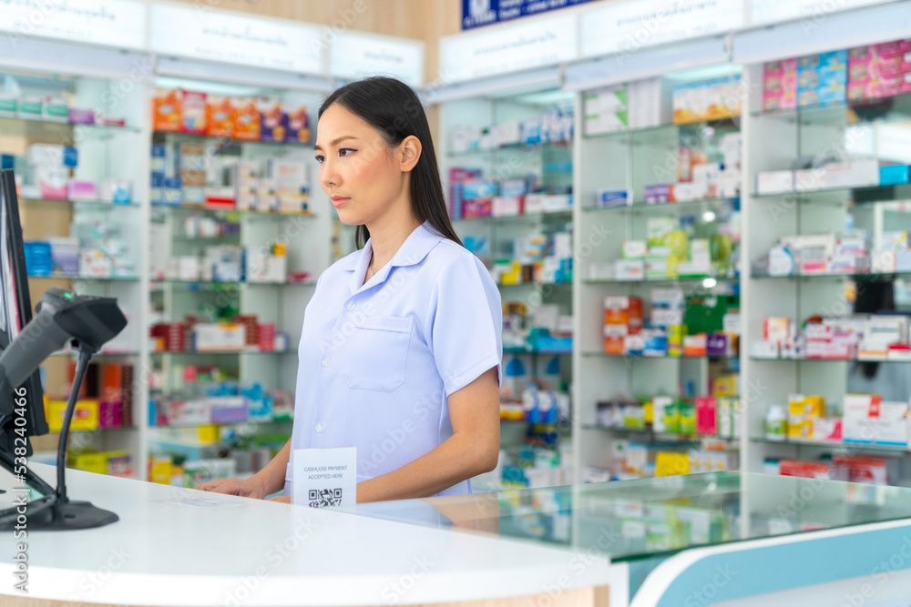 Portrait of Attractive Asian woman professional pharmacist ready for medication advice about medicine, drugs and supplements in modern drugstore. Medical pharmacy and healthcare providers concept.