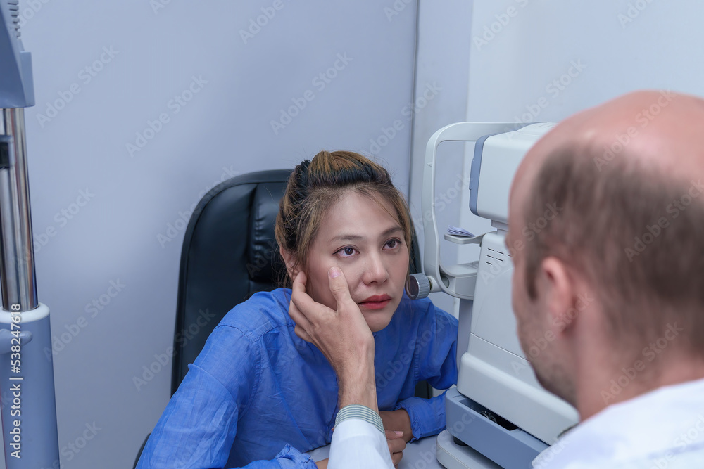 The doctor ophthalmologist examines the patient's eyes. The doctor ophthalmologist examines the patient's eyes.