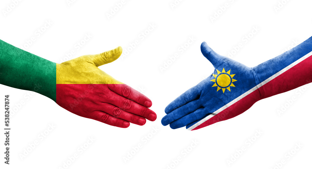 Handshake between Benin and Namibia flags painted on hands, isolated transparent image. Handshake between Benin and Namibia flags painted on hands, isolated transparent image.