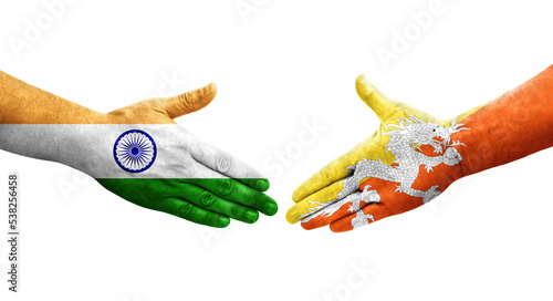 Handshake between Bhutan and India flags painted on hands, isolated transparent image.