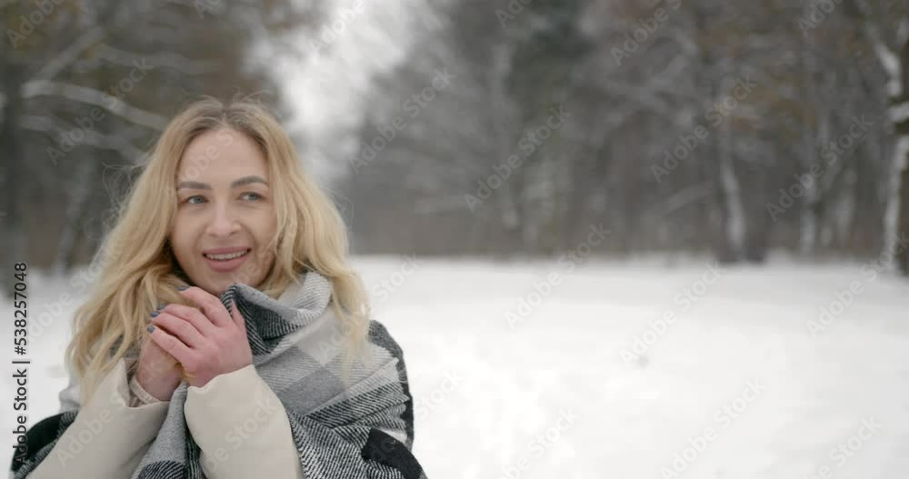 Beautiful young woman with scarf on a snowy winter day Beautiful young woman with scarf on a snowy winter day