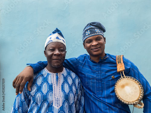Portrait of Father and son with talking drum