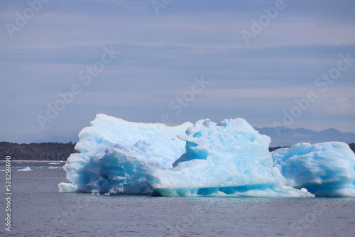 Stunning Iceberg from San Rafael Glacier Adrift in the Serene Lagoon of Chile photo