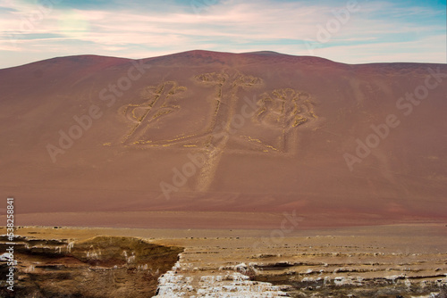 The Paracas Candelabra, is a famous geoglyph, located on the north coast of the Paracas peninsula, in the province of Pisco, within the department of Ica, in Peru. photo