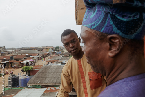 Nigeiran boy from Ogun State and father at the balcony  photo
