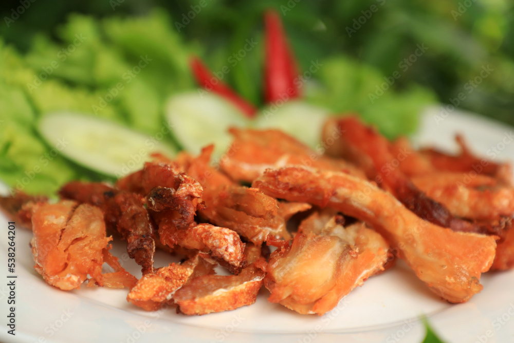Orange Salmon Belly that has been fried and used to make food
