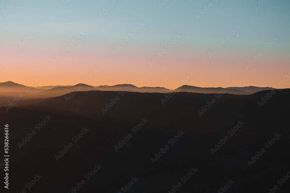 Beautiful mountains view in the morning. Sunrise autumn foggy landscape Beautiful mountains view in the morning. Sunrise autumn foggy landscape