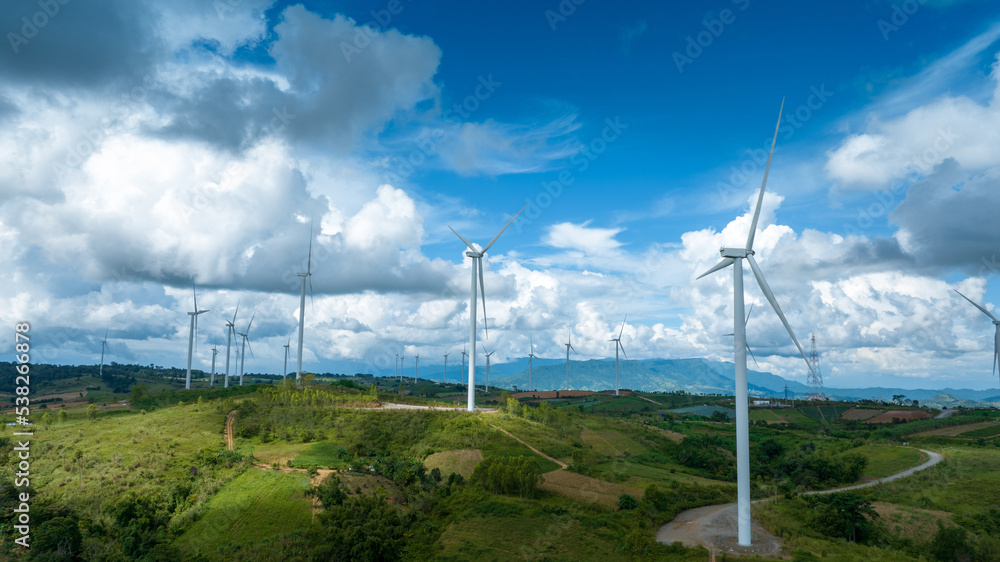 Wind Turbines Windmill Energy Farm, Windmill on blue sky puffy clouds
Alternative energy sources. Renewable electric sustainable nature energy technology. 
