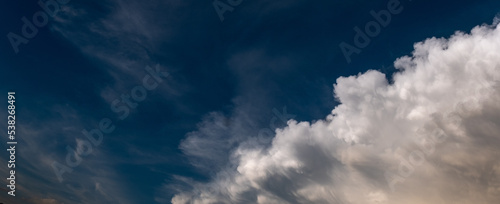 expressive clouds in a dark blue sky