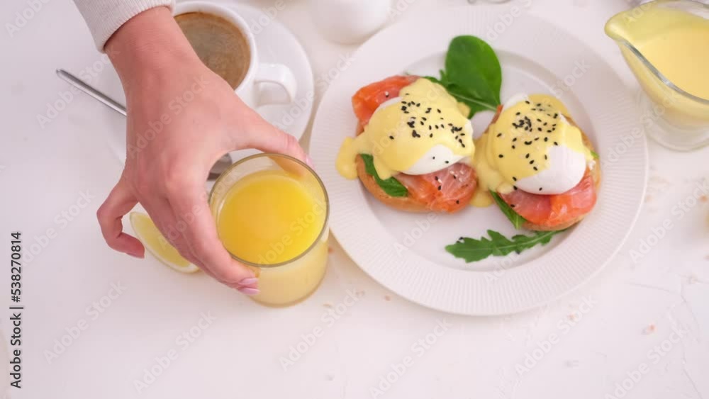 tasty benedict egg breakfast - Salmon fillet sandwich with cream cheese and poached egg at domestic kitchen tasty benedict egg breakfast - Salmon fillet sandwich with cream cheese and poached egg at domestic kitchen