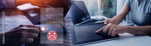 Foto Customer Experience dissatisfied Concept, Unhappy Businessman Client with Sadness Emotion Face on smartphone screen, Bad review, bad service dislike bad quality, low rating, social media not good