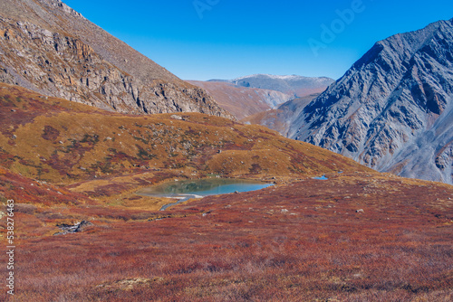 Mountain glacier lake. Picturesque hidden location in the mountains. Outdoors style vacation. Adventure travel in the wildlife, no people. Mountain valley landscape stock photo