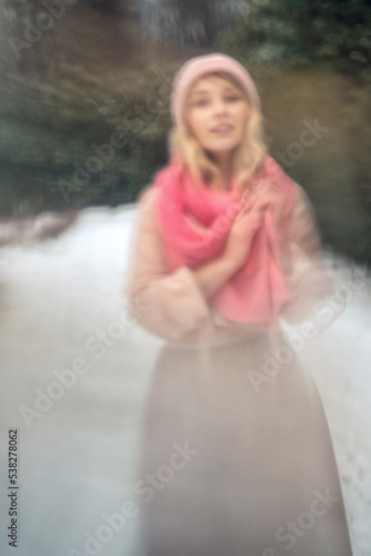 New Year's photos of a beautiful girl in the forest with a decorated Christmas tree, filled with comfort and magic