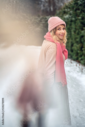 New Year's photos of a beautiful girl in the forest with a decorated Christmas tree, filled with comfort and magic