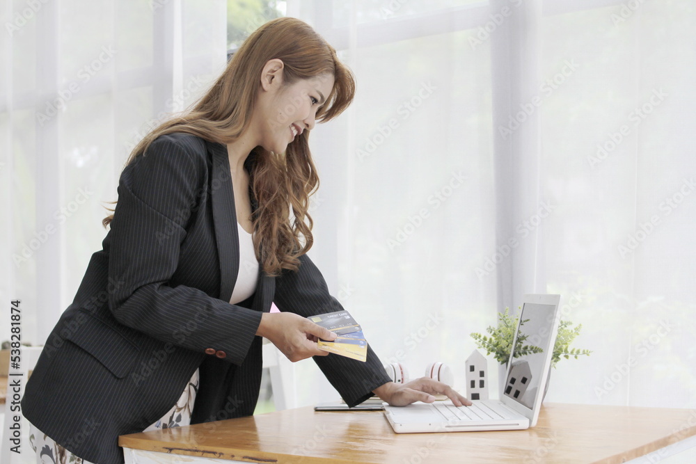woman's hand has a credit card online trading concept woman's hand has a credit card online trading concept