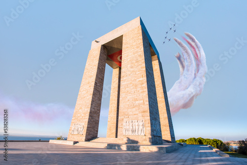 Air Force aerobatic team performing demonstration flight over Canakkale Martyrs' Memorial against to Dardanelles Strait