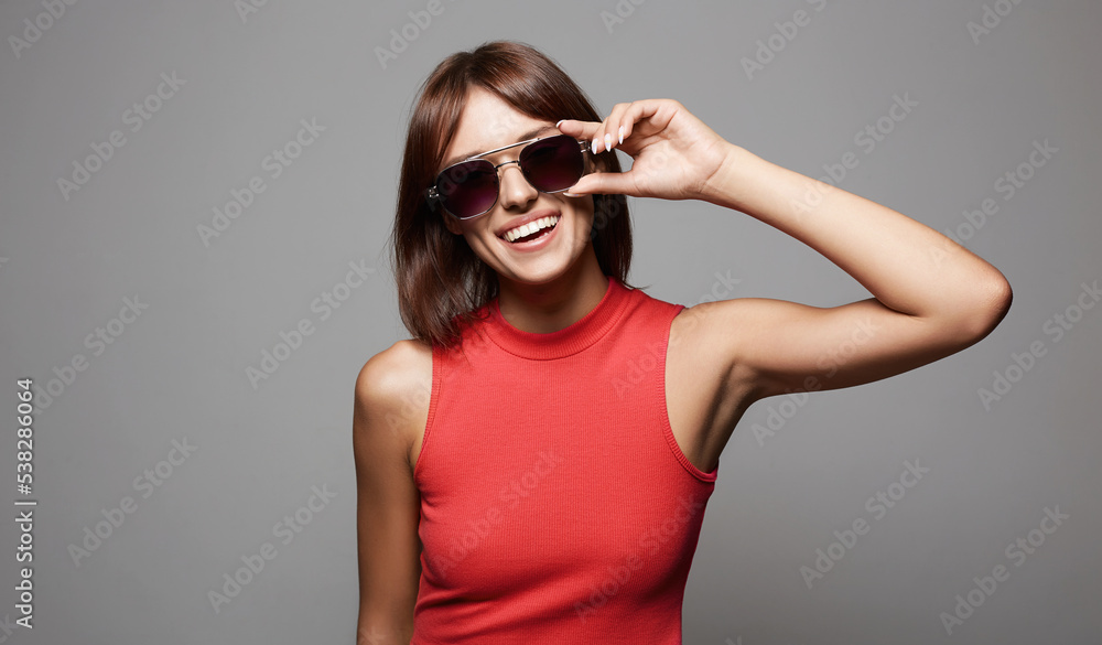 Happy beautiful Girl in Sunglasses. Smiling young woman Happy beautiful Girl in Sunglasses. Smiling young woman