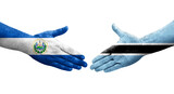 Handshake between Botswana and El Salvador flags painted on hands, isolated transparent image.