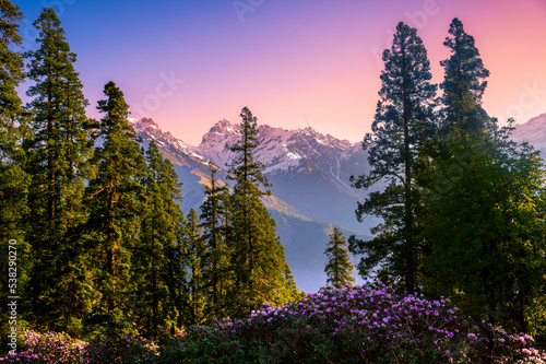 Sunset in the mountains. These are the scenic meadows of the Parvati valley Himalayan region. Peaks and alpine landscape from the trail of Sar Pass trek, Himalaya, Kasol, Himachal Pradesh, India.
