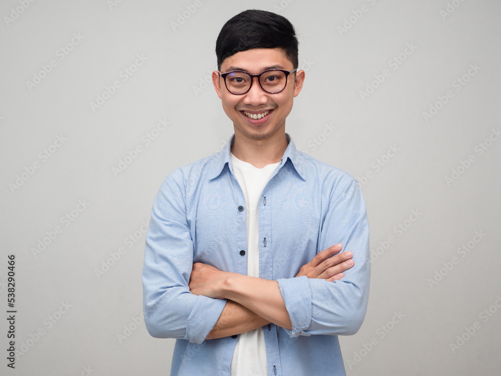 Handsome business asian man crossing arms with smiling isolated Handsome business asian man crossing arms with smiling isolated