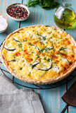 Pie with zucchini, cheese and herbs. Quiche. Vegetarian food. Healthy eating.