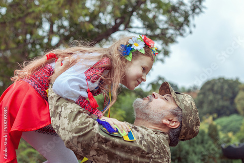Little Ukrainian girl meets dad from the war.