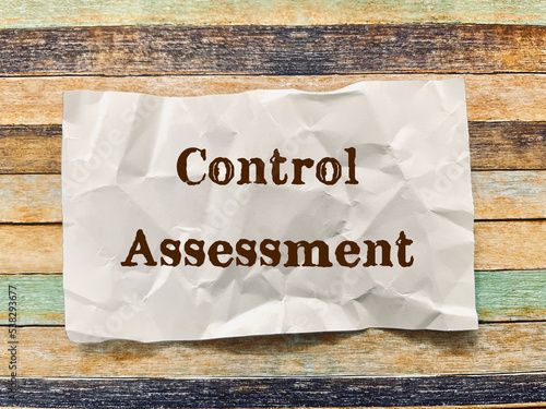 control assessment word on crumpled paper note